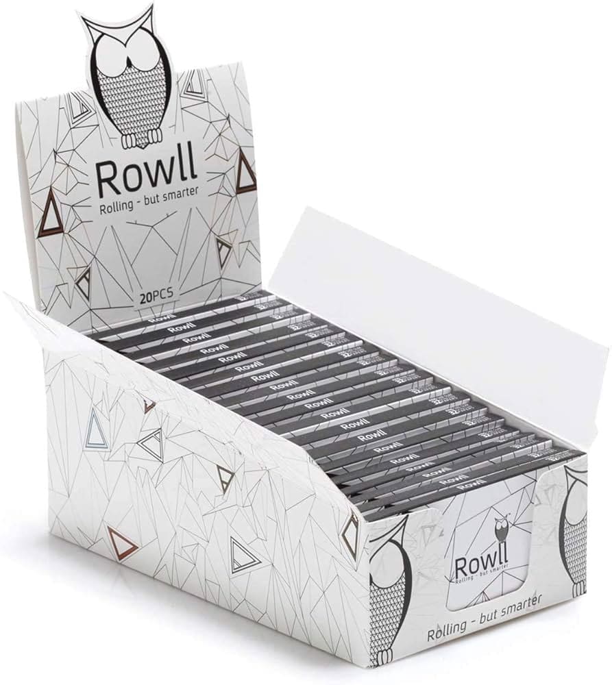 An open box containing 20 packs of Rowl Rolling Papers features a geometric owl design with the brand name Rowll and the slogan Rolling - but smarter. Vapehub acworth, Georgia